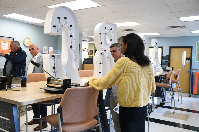 Employee Discussing Production Lab with Attendee